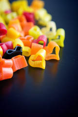 Heart-shaped pasta on black table