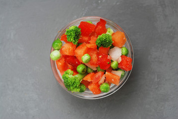 Top View of mixet Colorful Vegetables on Gray Background. Healthy and Veggy Food Concept.