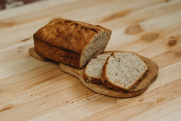 Time to eat. Close-up of sliced banana bread on a desk in the kitchen. Tasty food. Delicious eats. Healthy life