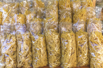 noodles ( hilopites) in their packaging on the shelf
