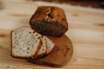 Time to eat. Close-up of sliced banana bread on a desk in the kitchen. Tasty food. Delicious eats....