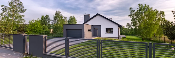 Foto op Canvas House with fence and garage © Dariusz Jarzabek