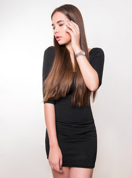 beautiful young woman with long hair wearing wrist watch