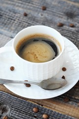 Delicious fresh Americano coffee on the wooden table 