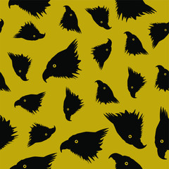 Seamless pattern black eagle head on the gold background