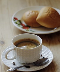 Delicious Americano coffee and pies on the table 