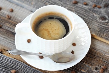 Delicious fresh Americano coffee on the wooden table 