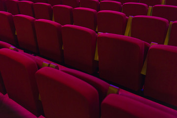 Red seats in cinema, theater, concert hall.