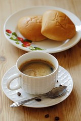 Delicious Americano coffee and pies on the table 