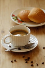 Delicious Americano coffee and pies on the table 