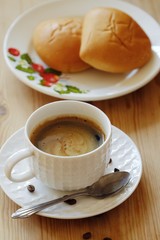 Delicious Americano coffee and pies on the table 