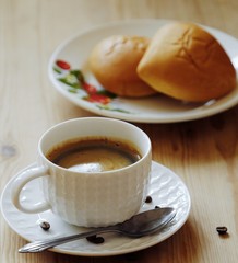 Delicious Americano coffee and pies on the table 