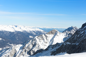 Fototapeta na wymiar Landscape of mountains in winter with blue sky