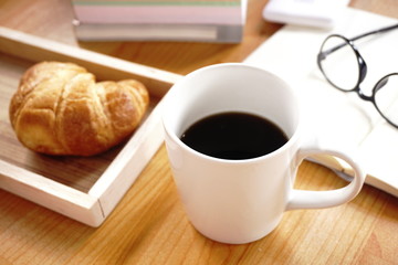 Coffee break with croissant