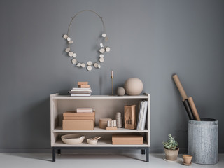 Shelf with lots of decoration, also on the wall, in natural tones