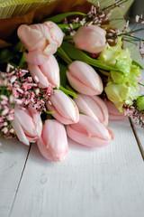 Bouquet of pink tulips on the table