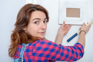 young woman doing DIY work at home