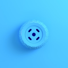 Car wheel on bright blue background