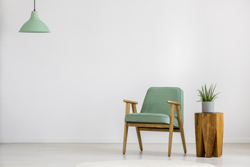 Vintage green armchair in room