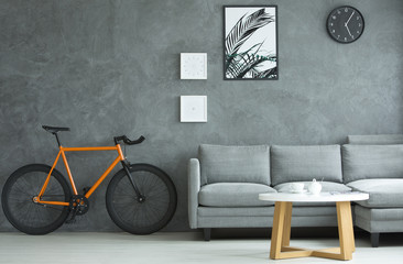 Orange bicycle in apartment interior