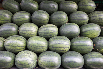 Fresh ripe watermelon on a stall for sell at fruit market, Mahanak, Bangkok, Thailand
