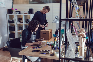 Masters who make jewelry from Venetian glass in their workshop.