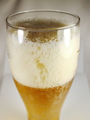 beer froth in a glass close up