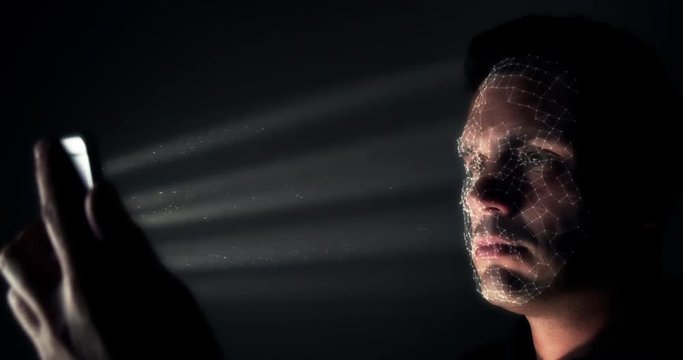 Inside the technical workings of facial recognition software. Camera floats inside the pixels mapping a face whilst using a cell phone