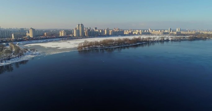 aerial view to the Dneper River along the Obolonskaya embankment in winter