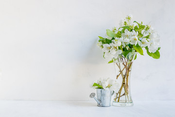 White flowers in a vase on a light background