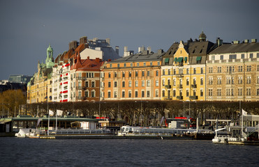 Fototapeta na wymiar Houses at the pier of northern Stockholm in mid winter sun