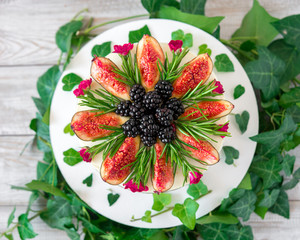 delicious and very pretty carrot walnut cake with figs BlackBerry and rosemary