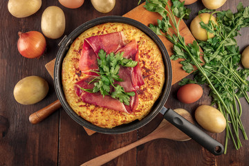 Spanish tortilla with ingredients and place for text