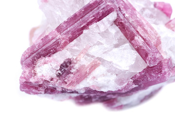 Rough white quartz studded with pink tourmaline crystals, from Brazil isolated on white background