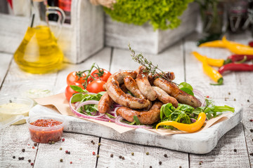 Grilled sausages and vegetables
