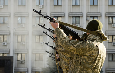 The military in the form of shooting with a Kalashnikov assault rifle. Military conflict. War