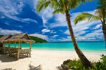 Paradise-like scenery on the magnificent beach of Siam Bay with palm trees on the right and...