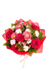 Bright buketny composition from fresh flowers, the white isolated background