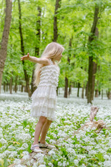 girl in white dress in spring forest