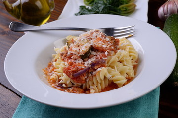 Fusilli pasta dish in the sauce with carrots and zucchini
