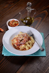 Fusilli pasta dish in the sauce with carrots and zucchini
