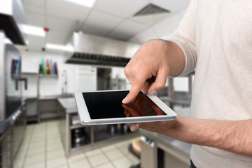 hands holding a tablet