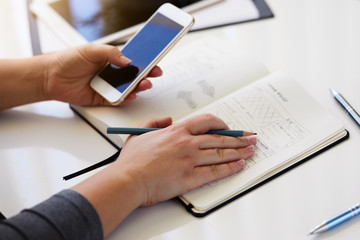 Close up of woman sketching graphic sketch in office