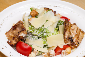 Caesar Salad plate with chicken breast pieces