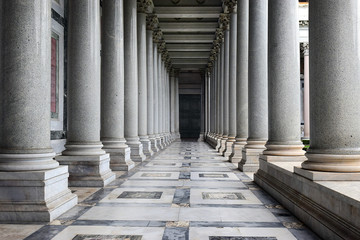 colonnade of papal Basilica of St. Paul outside the Walls in Rome, Italy