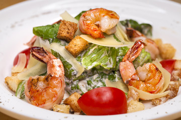 Fototapeta na wymiar Seafood Caesar Salad with Shrimps
