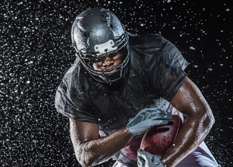 Water splashing on football player