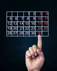 Finger touch the calendar.