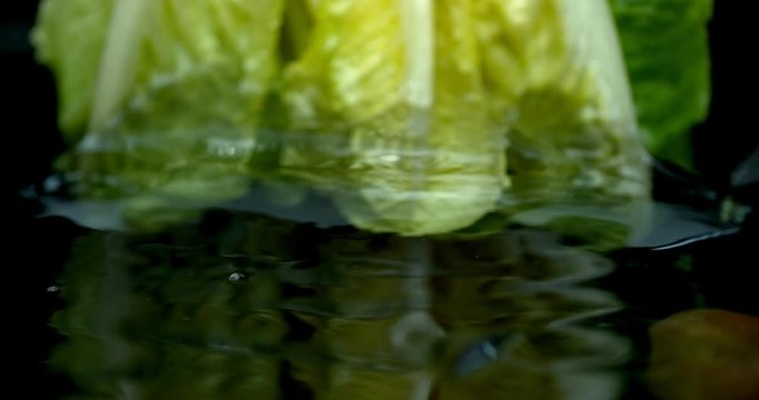 Lettuce green leaf salad slow motion water washing shot on Phantom Flex 4K