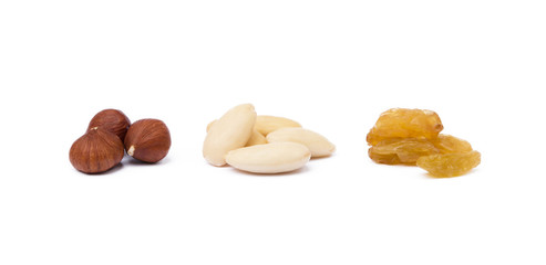 Mixed fresh nuts and raisins isolated on white background